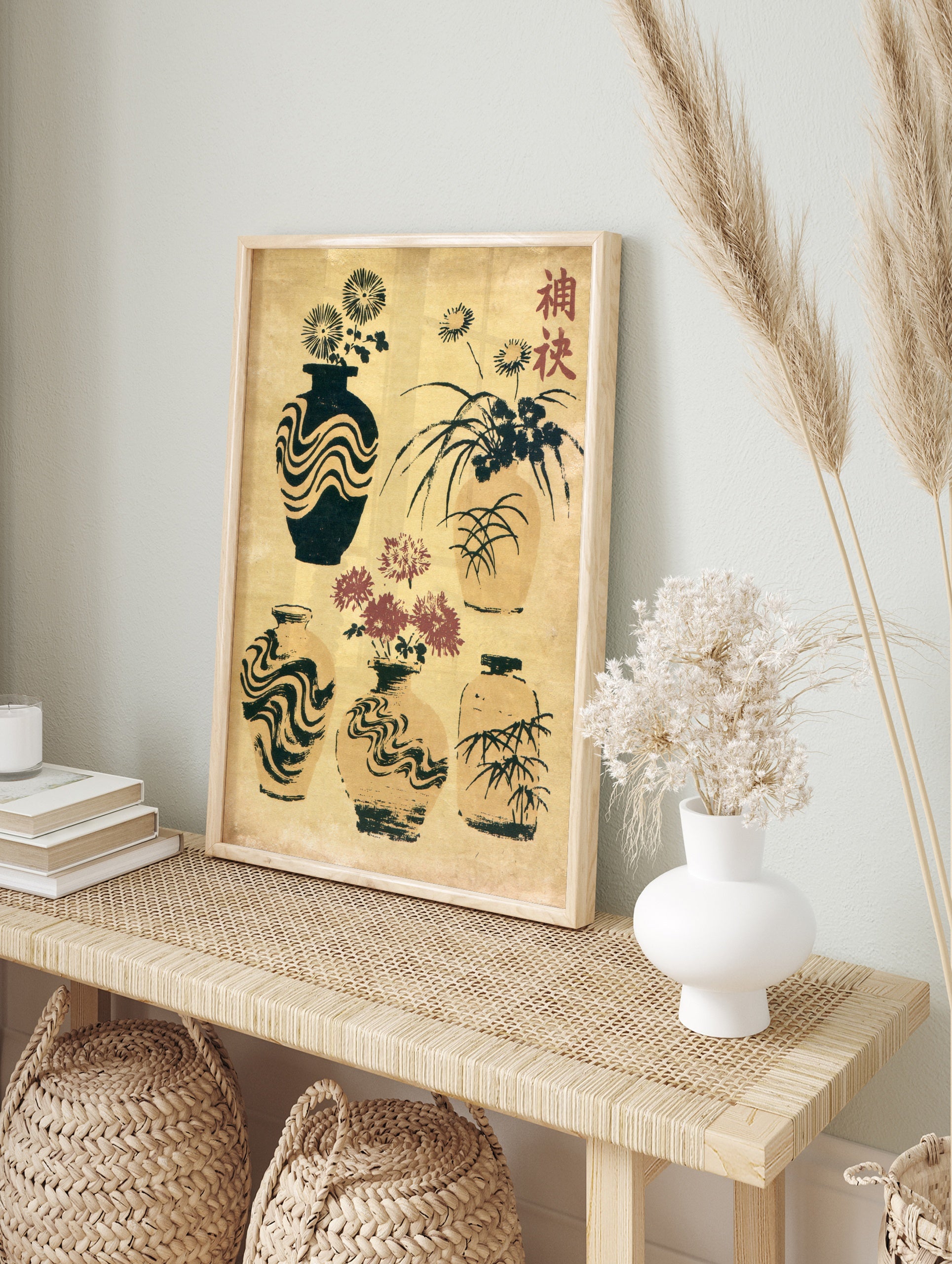 Japanese vase illustration art print with chrysanthemum flowers, bamboo, and kanji text on a, in an alternate framed mockup
