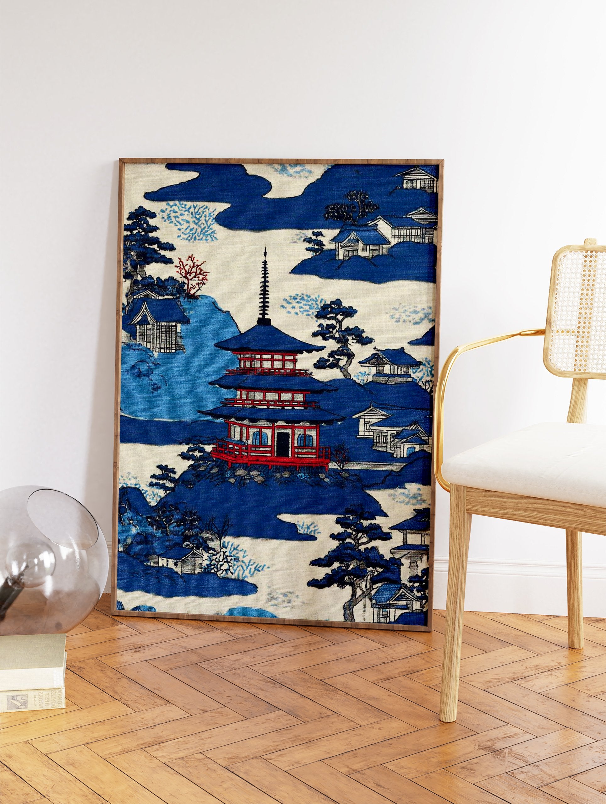 Japanese Wall Art print of a blue pagoda, traditional houses, and trees in a serene mountain landscape. - Image 2