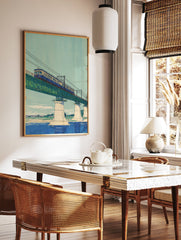 Japanese wall art print of a blue train on a green truss bridge over a river, with a light blue sky and distant landscape. - Image 2