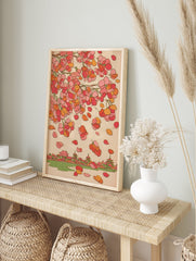 Traditional Japanese wall art featuring pink and orange cherry blossoms falling over a village with temples and a river. - Image 3