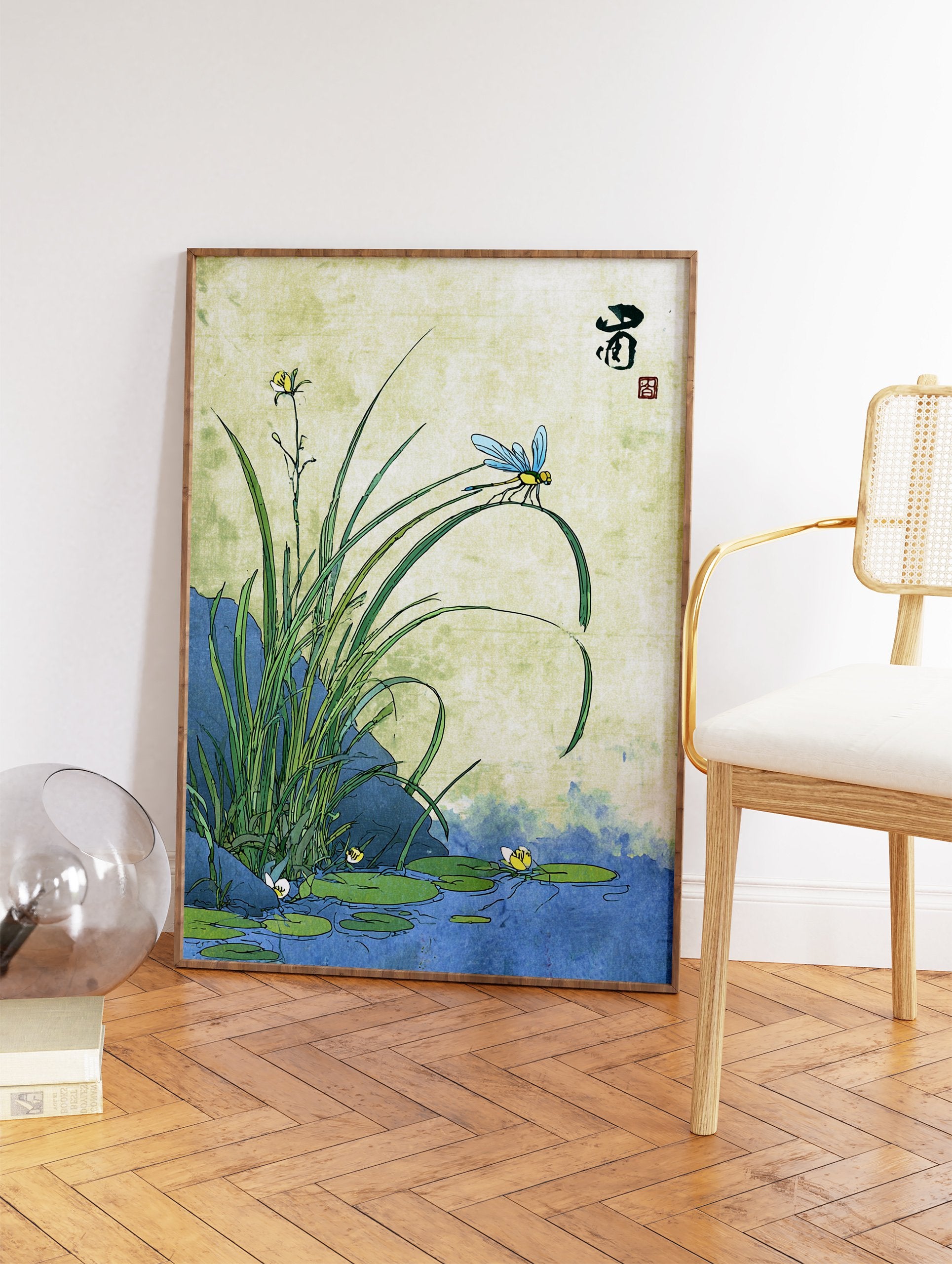 Japanese Dragonfly Wall Art featuring a blue dragonfly on a green leaf over a pond with lily pads and water plants. - Image 2