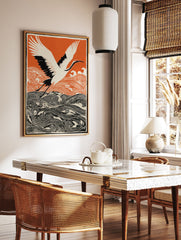Japanese wall art print of a white and black crane flying over orange and black stylized waves against an orange sky. - Image 3