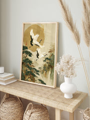 Japanese wall art print with two flying red-crowned cranes over a serene mountain landscape, pine trees, and traditional buildings. - Image 3