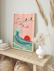 Japanese Wall Art with a flock of cranes flying over a large blue-green ocean wave and a red sun against a pink sky. - Image 3
