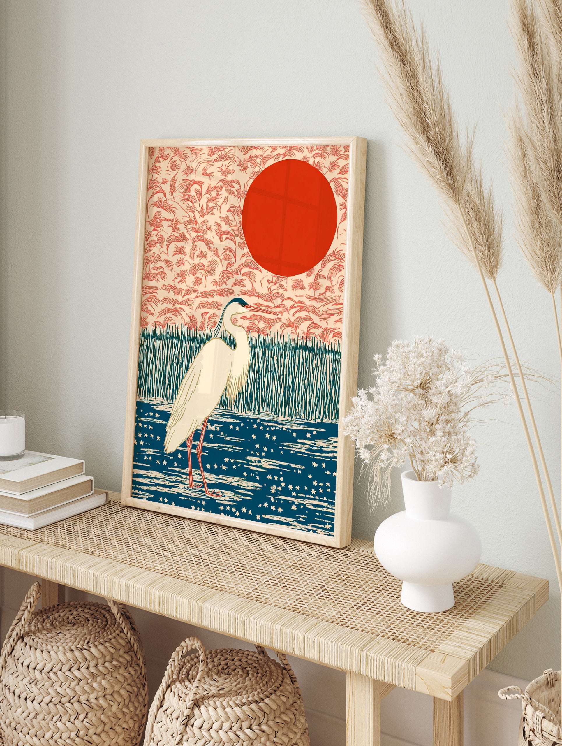 Japanese wall art print of a white heron bird in a blue pond with green reeds and a red sun against a peach sky. - Image 3