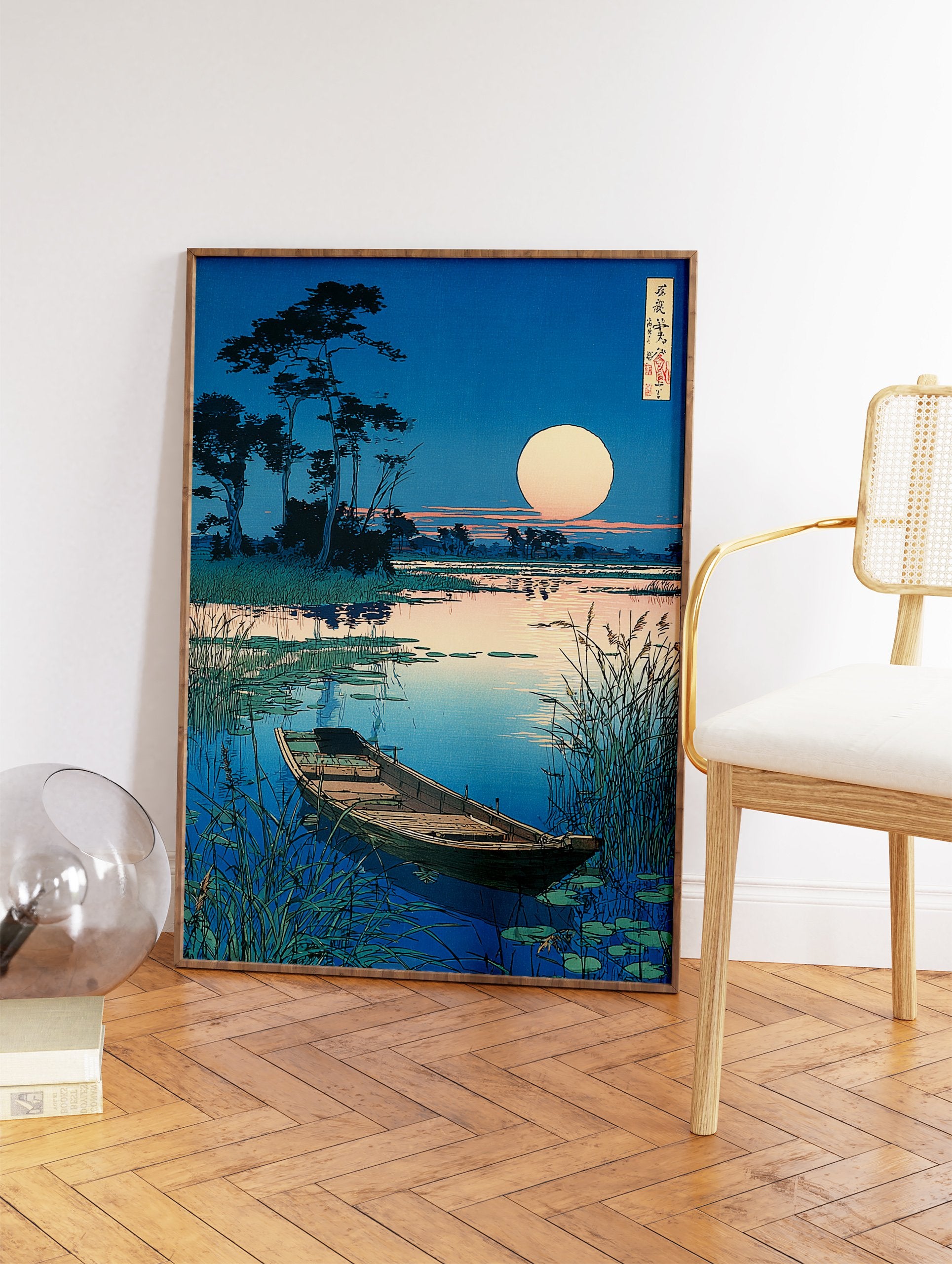 Japanese Ukiyo-e style wall art print featuring a serene moonlit landscape with a boat on a calm lake and tall reeds. - Image 2
