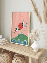 Japanese wall art featuring two majestic cranes flying over Mount Fuji with a red sun and ocean waves, on a pink background. - Image 3
