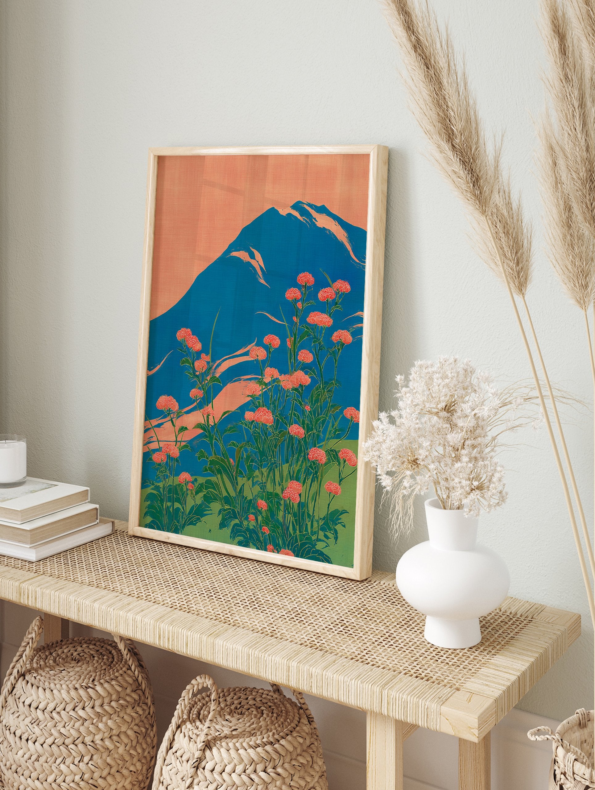 Japanese wall art print of Mount Fuji with red-orange flowers and a blue mountain against an orange sky. - Image 3