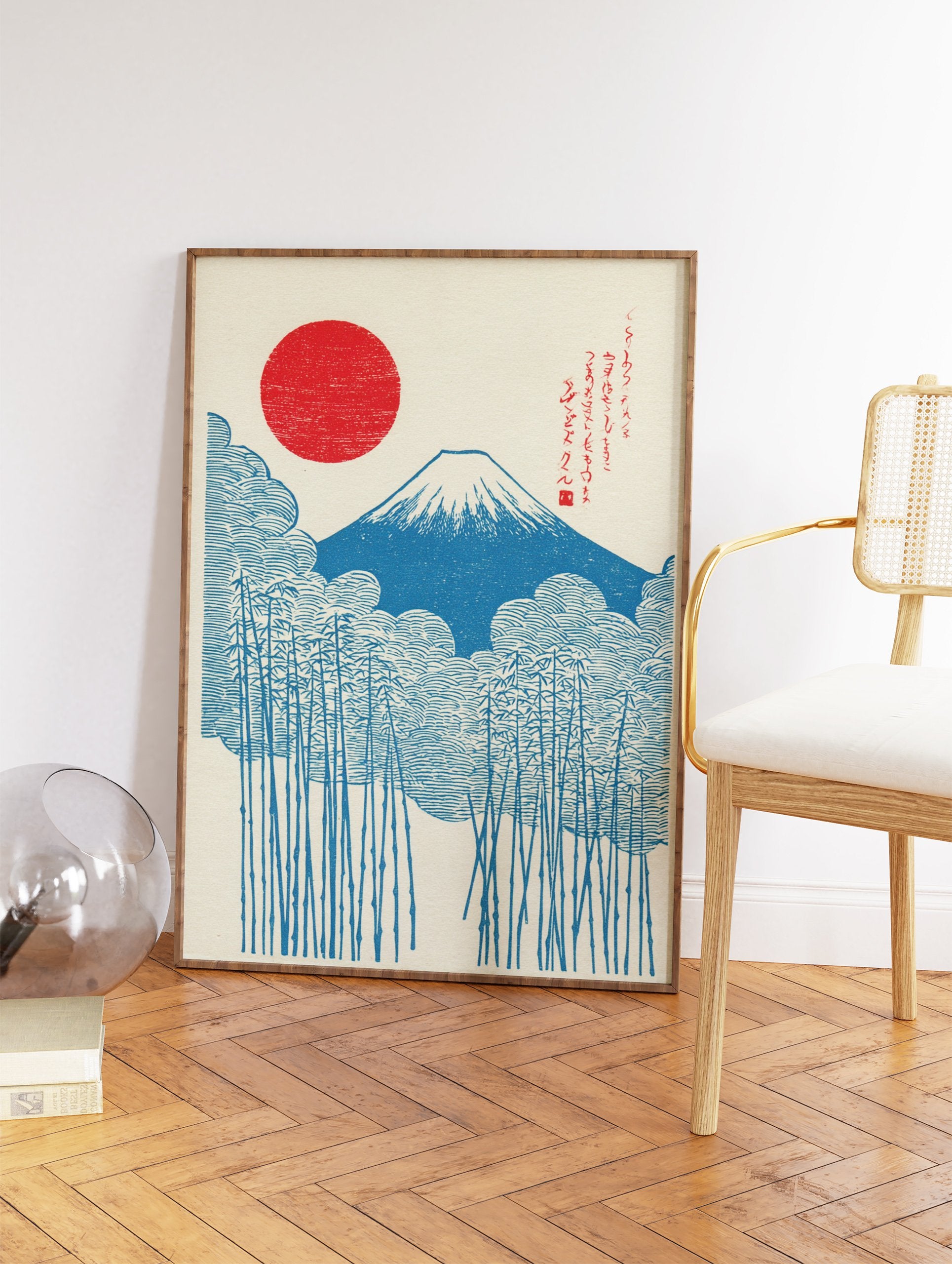 Japanese woodblock style print of Mount Fuji, a red rising sun, blue clouds, and bamboo stalks on a cream background. - Image 2