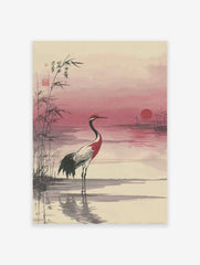 Japanese wall art print of a red-crowned crane in water with bamboo and a pink sunset.