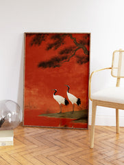 Japanese wall art print featuring two red-crowned cranes on a bank with a pine tree against a rich red background. - Image 2