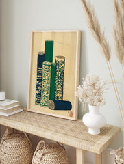 Japanese wall art print depicting several rolled textiles or scrolls with green, blue, and cream patterns on a textured background. - Image 3