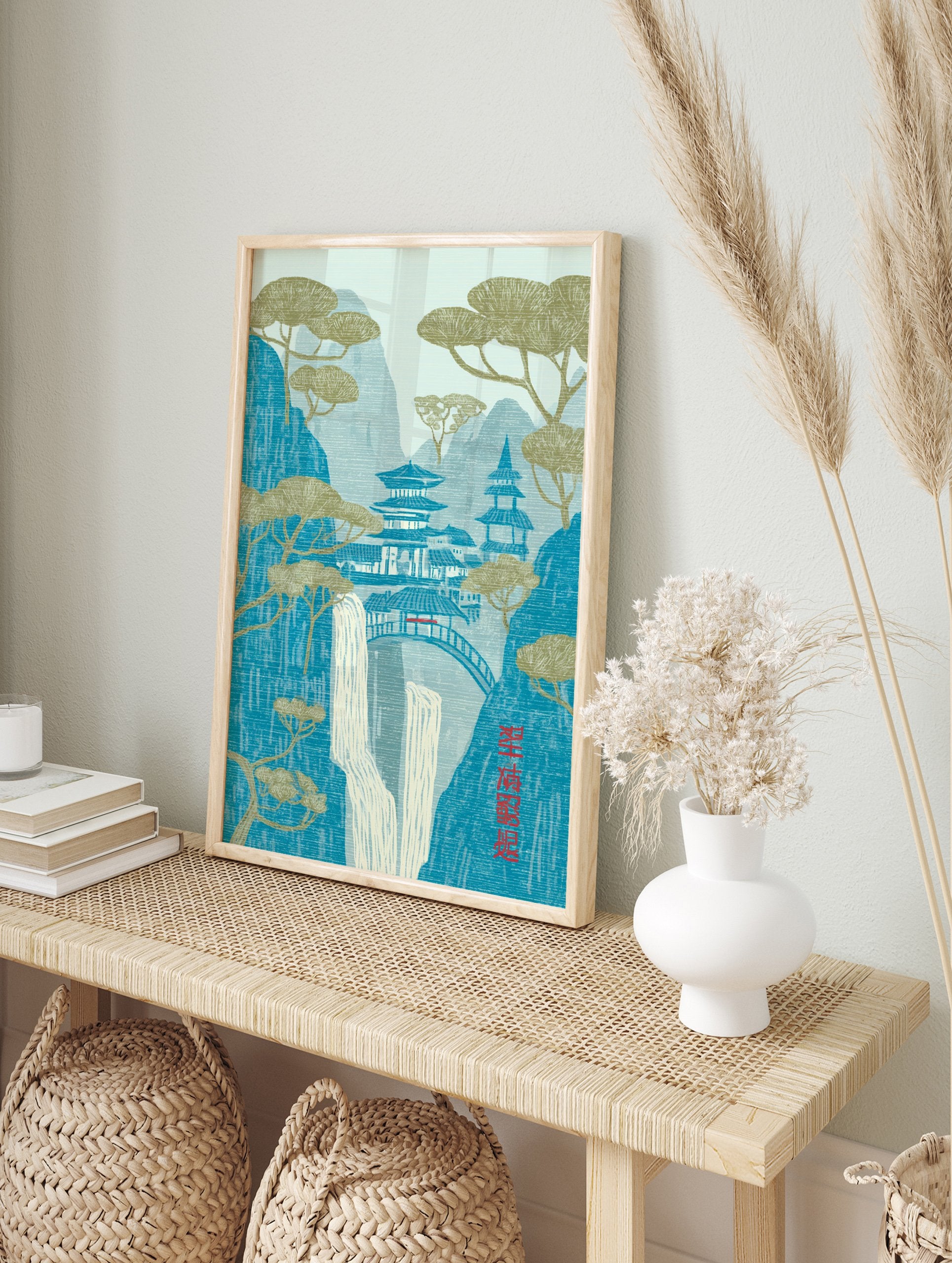 Japanese Wall Art print of a serene mountain landscape with traditional pagodas, cascading waterfall, and stylized pine trees. - Image 3