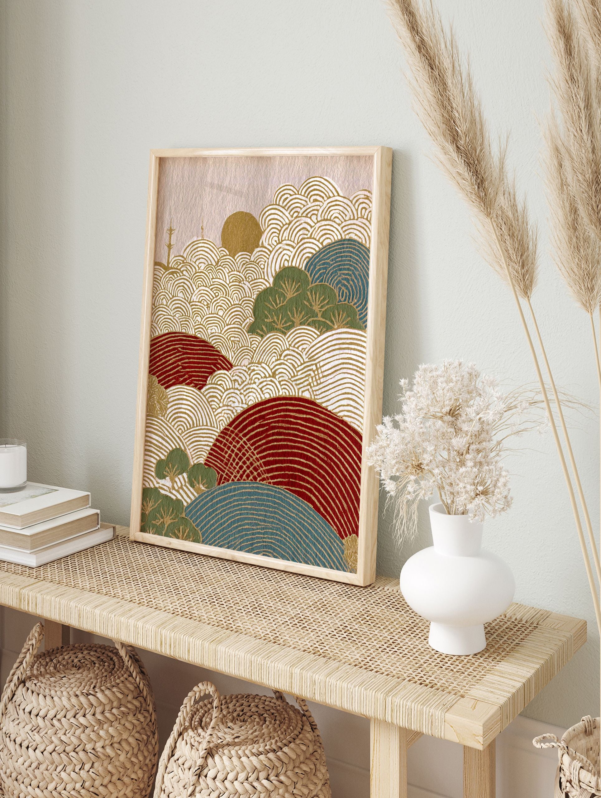 Stylized Japanese landscape wall art print with gold wave patterns, red and blue hills, green trees, and a golden sun. - Image 3