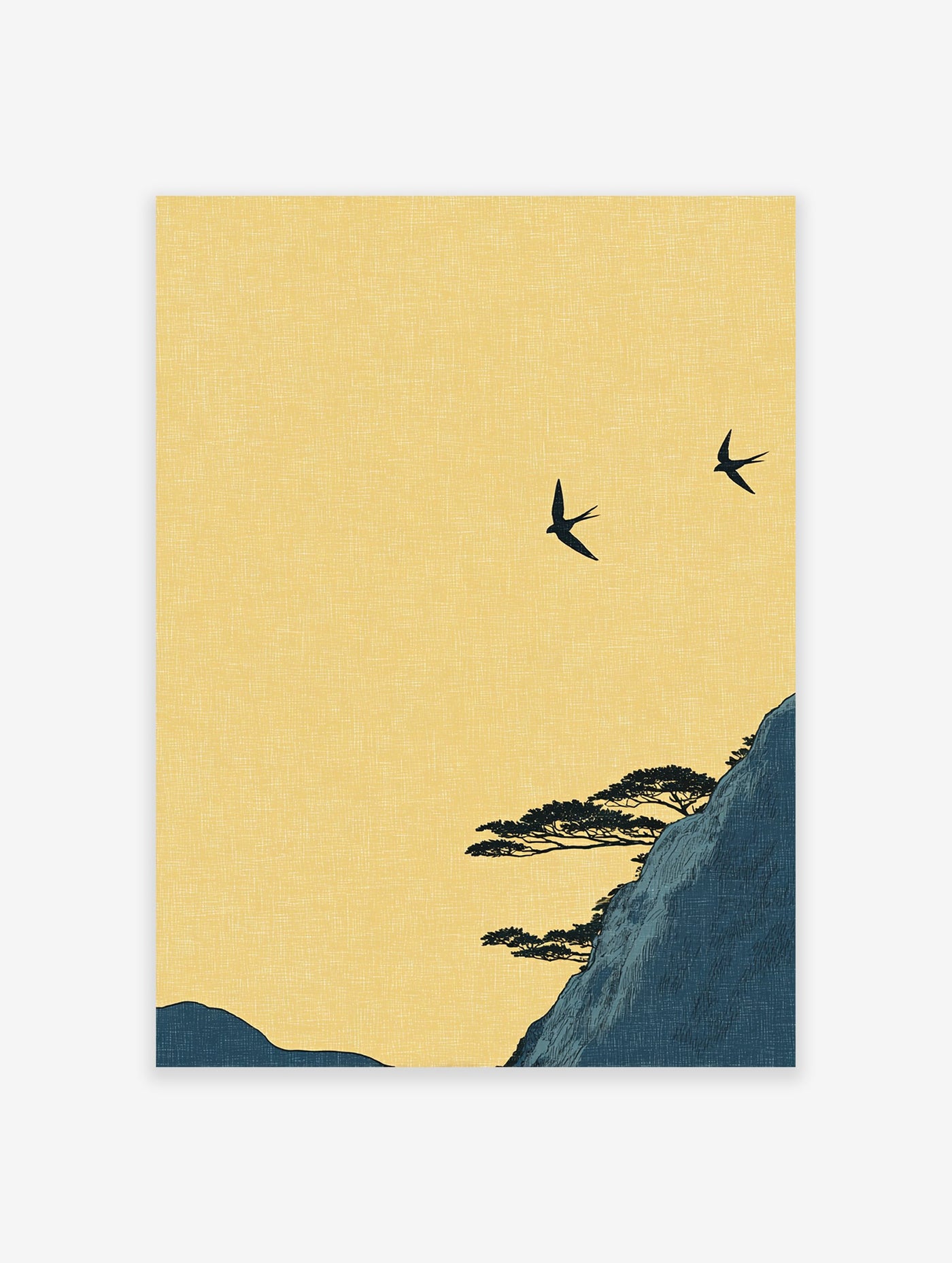 Japanese wall art print of two black swallows flying over a dark blue mountain with pine trees under a yellow sky.