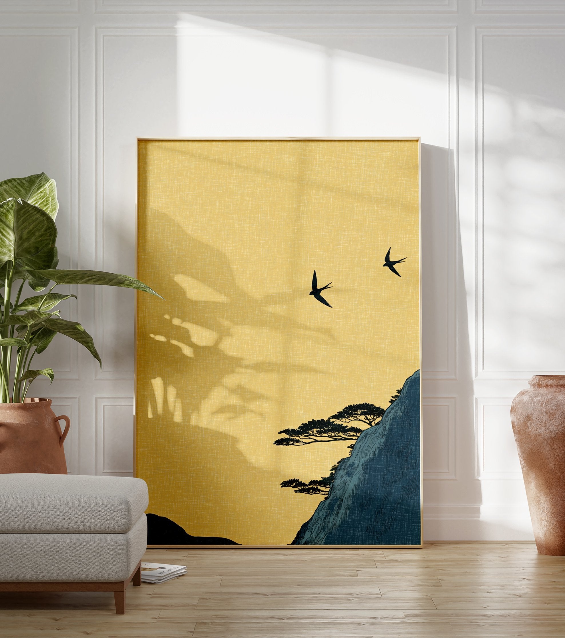Japanese wall art print of two black swallows flying over a dark blue mountain with pine trees under a yellow sky. - Image 3