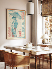 Traditional Japanese Ukiyo-e print of a geisha with a blue umbrella in snow, featuring red accents and Japanese script. - Image 2