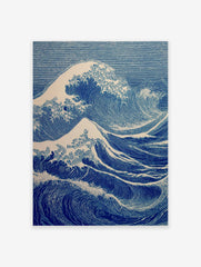 Blue Japanese Ukiyo-e style ocean wave art print with white foam on a white background.