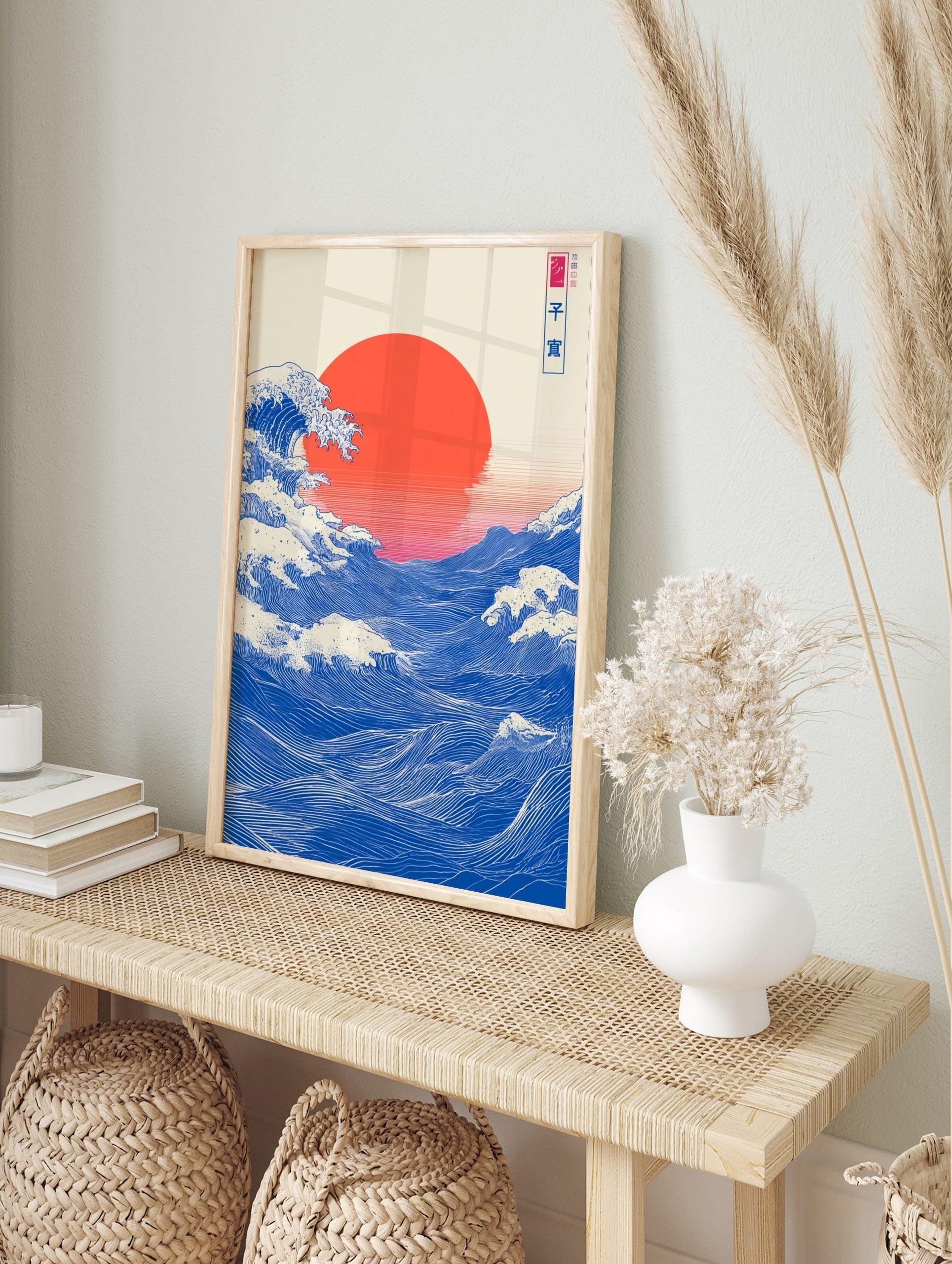 Japanese Ukiyo-e style ocean wave art print with large red sun and blue water, in an alternate framed mockup