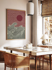 Japanese woodblock style art print with red sun and textured dark grey ocean waves, in a styled room mockup