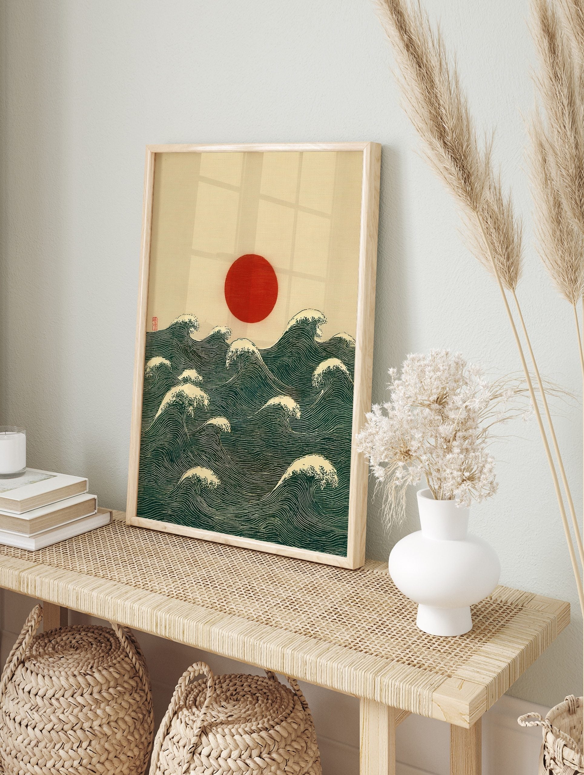 Red sun rising over deep blue-green ocean waves with white crests, Japanese woodblock style, in an alternate framed mockup