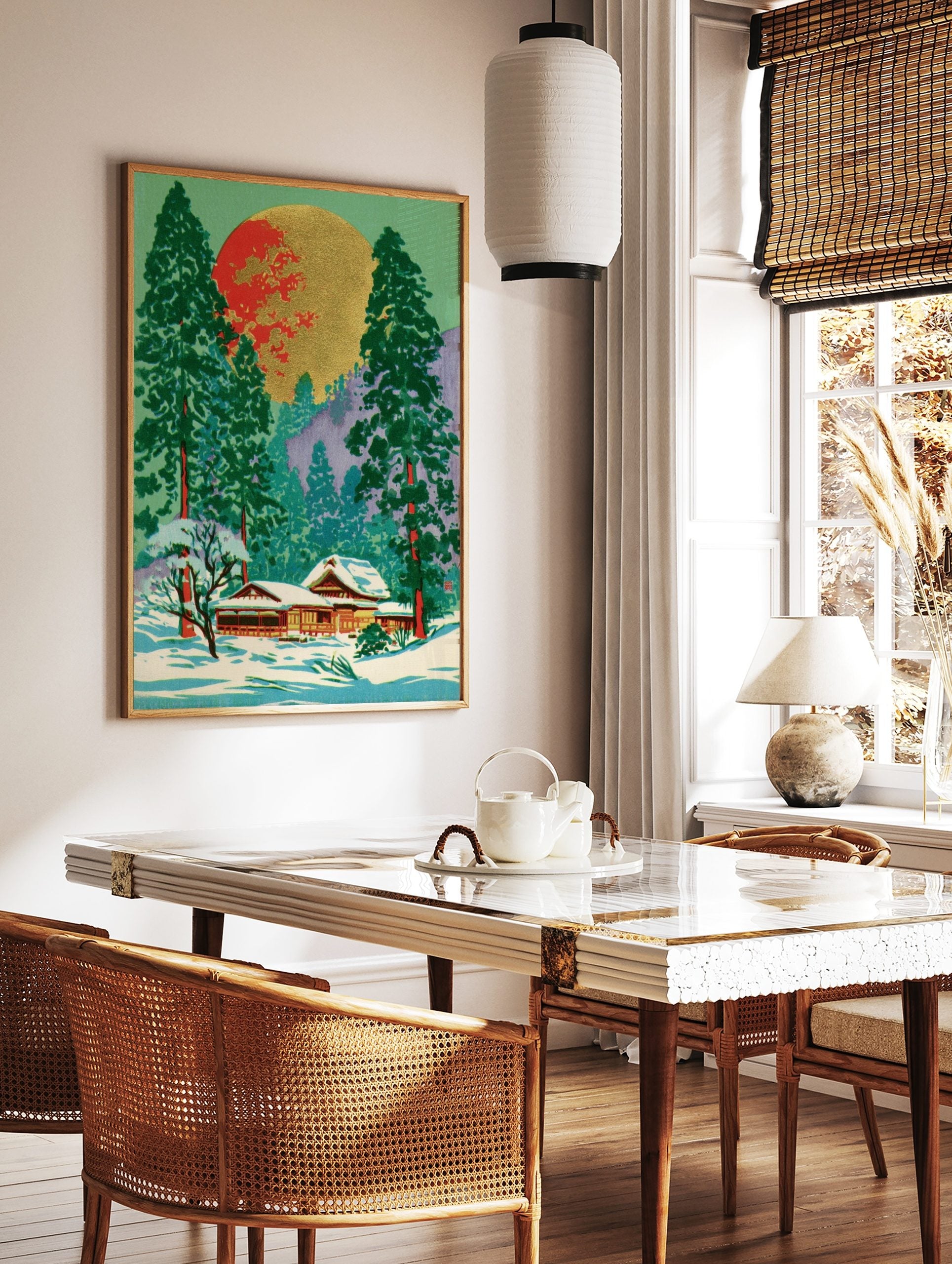 Japanese winter landscape art with snow-covered temple, green pine trees, and a large red and gold, in a styled room mockup
