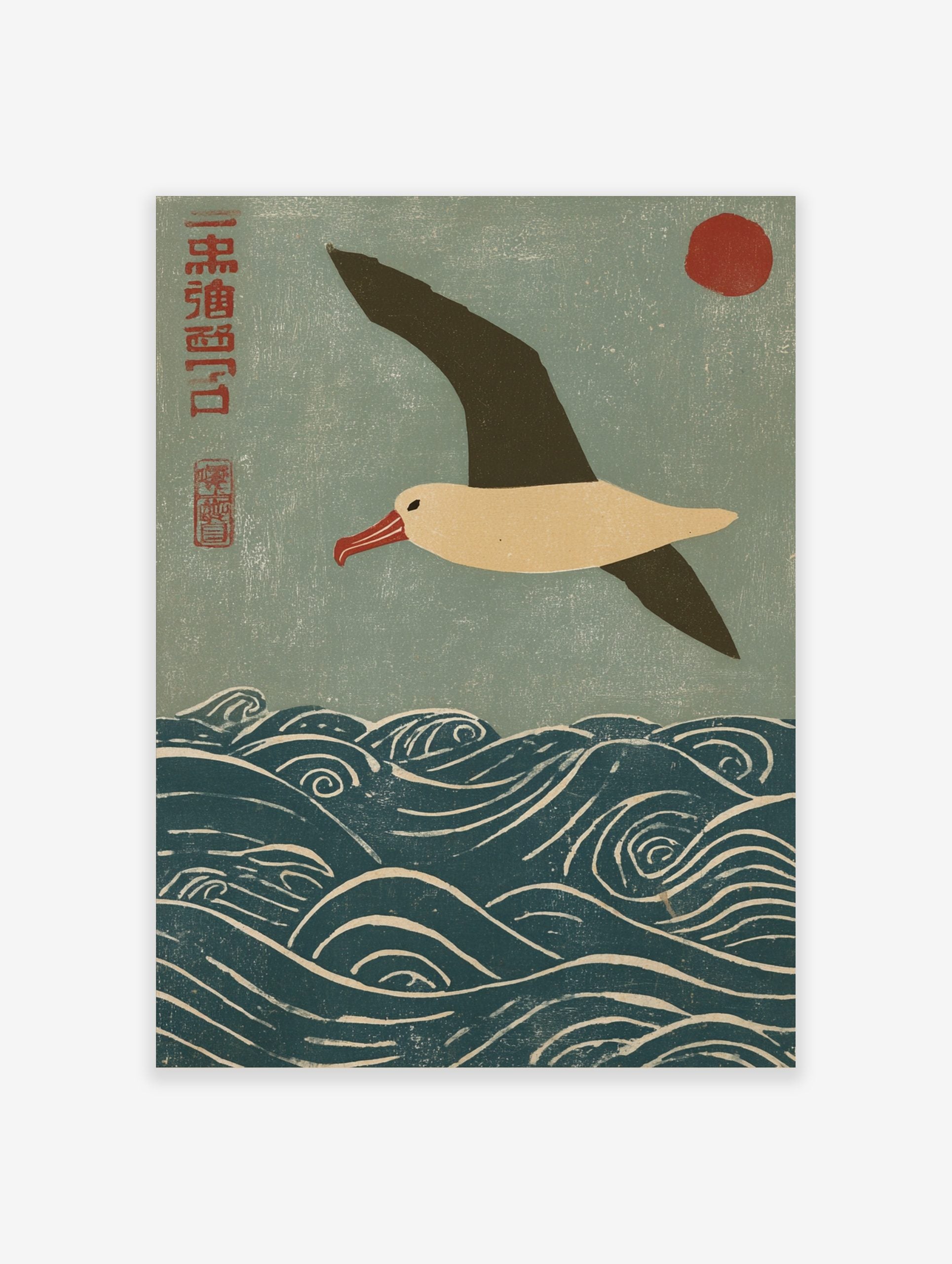 Japanese woodblock print of an albatross flying over blue waves with a red sun and kanji script