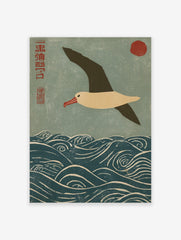 Japanese woodblock print of an albatross flying over blue waves with a red sun and kanji script