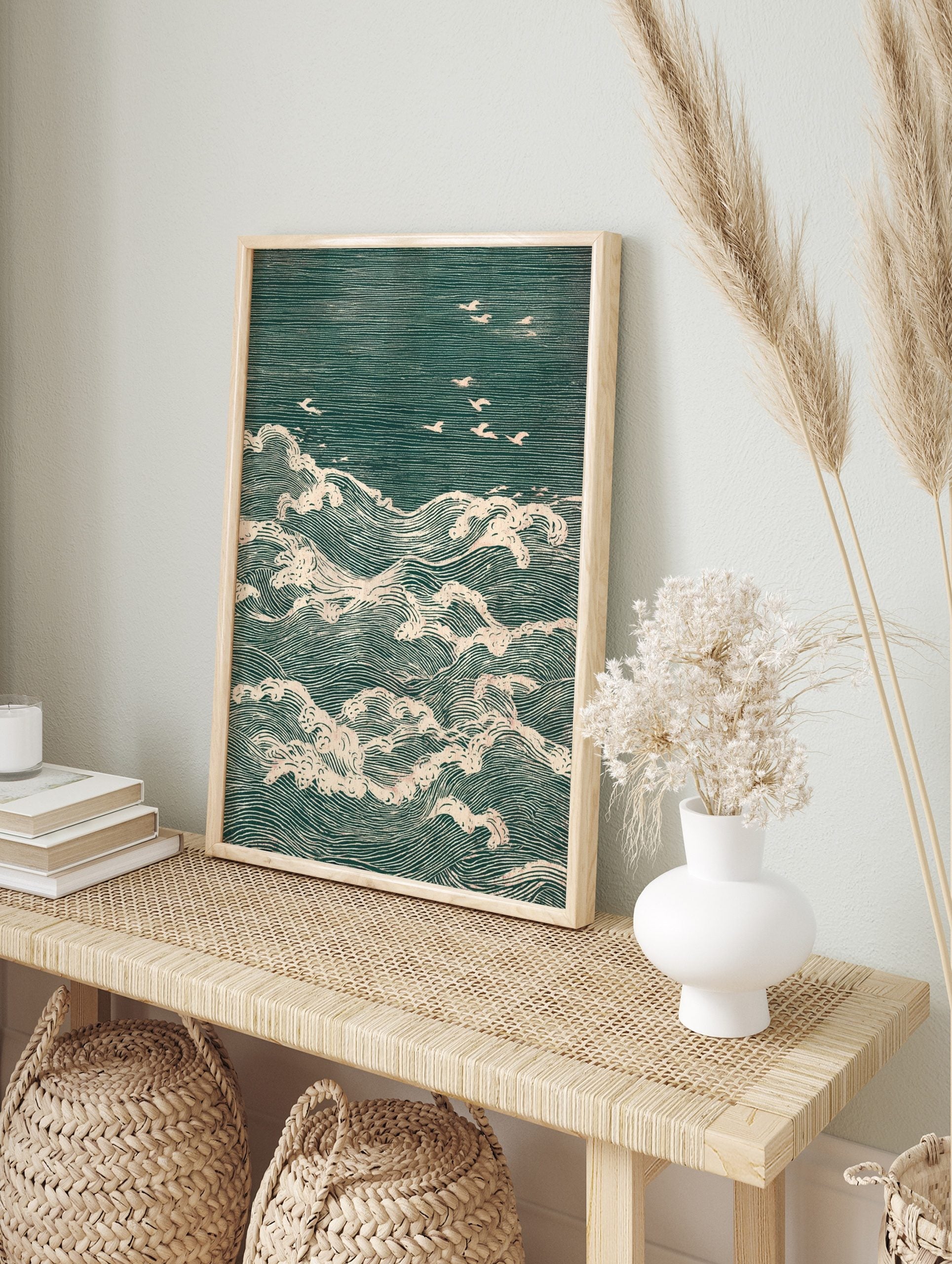 Japanese woodblock print of teal ocean waves with white foam and several white seagulls, in an alternate framed mockup