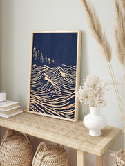 Japanese woodblock print style art with white stylised ocean waves and pine trees on a deep, in an alternate framed mockup