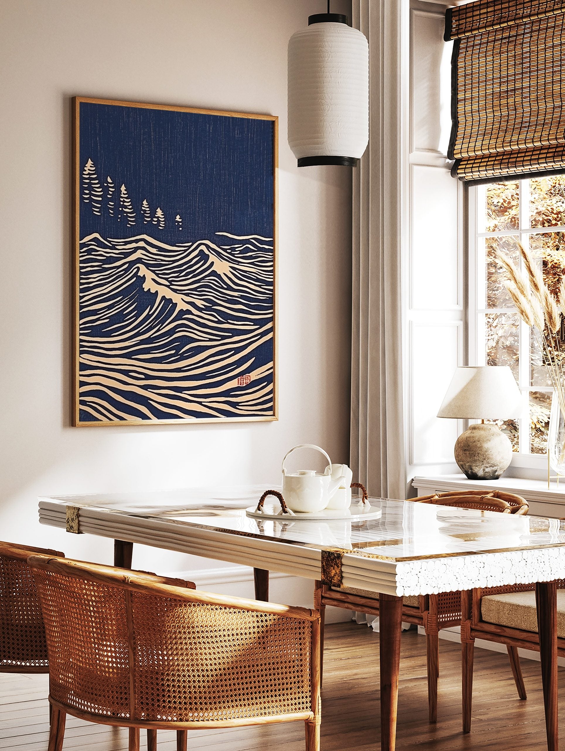 Japanese woodblock print style art with white stylised ocean waves and pine trees on a deep blue, in a styled room mockup