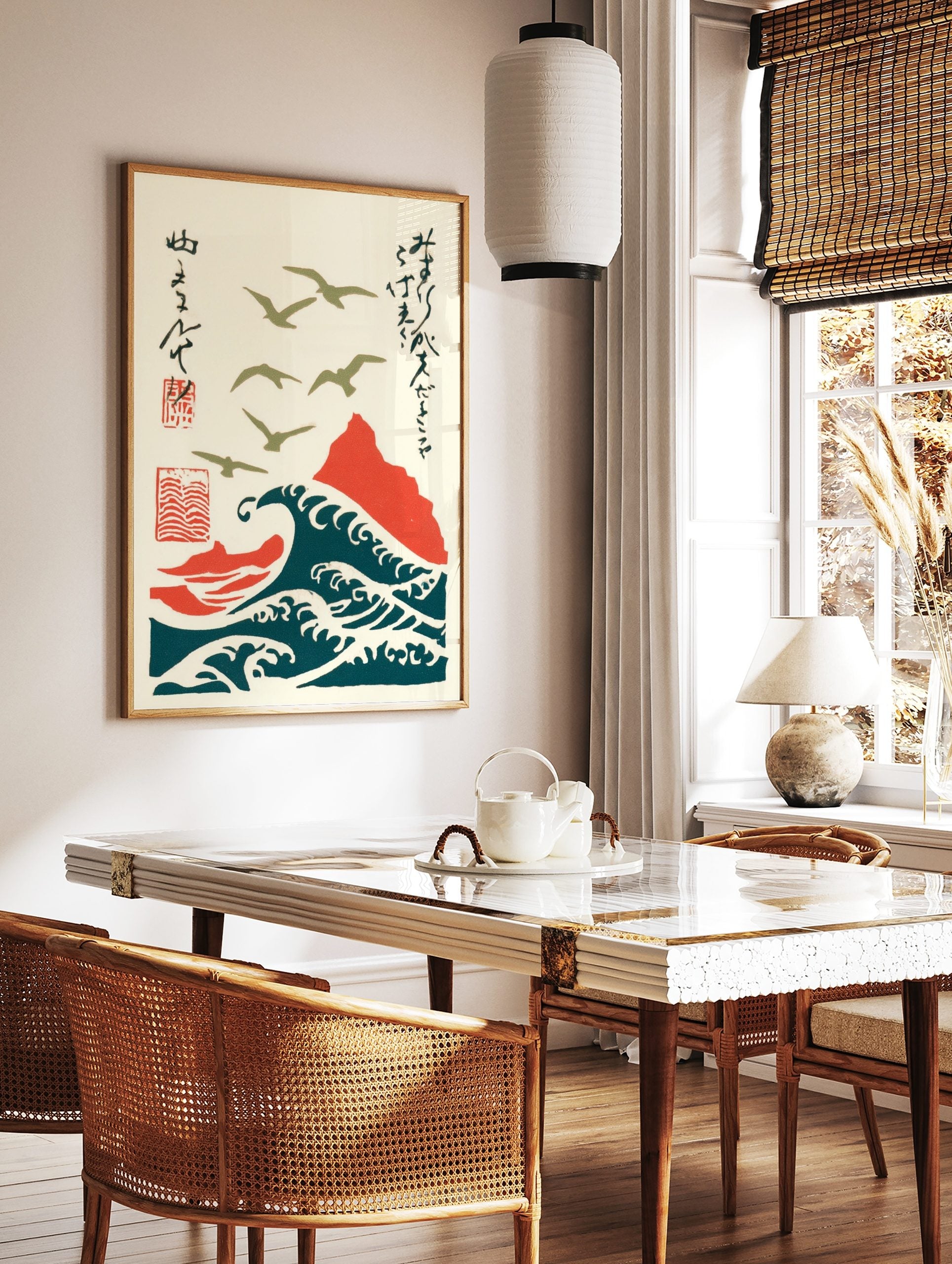 Japanese woodblock style art of olive green seagulls flying over deep teal waves and a red mountain, in a styled room mockup