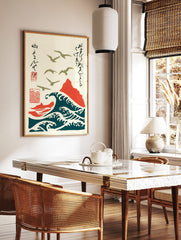 Japanese woodblock style art of olive green seagulls flying over deep teal waves and a red mountain, in a styled room mockup