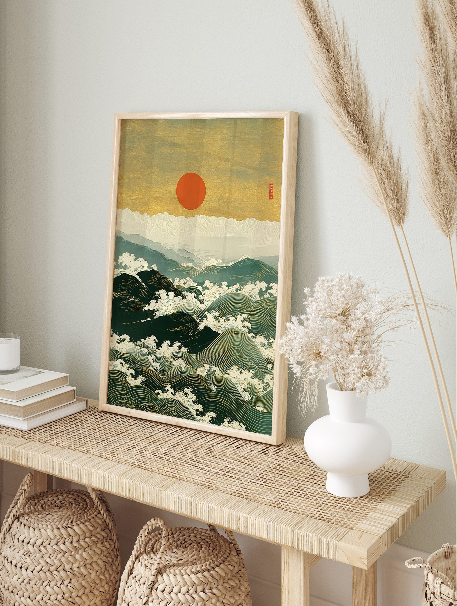 Japanese woodblock print of large ocean waves with white foam, distant mountains, and a red, in an alternate framed mockup