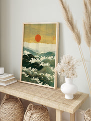 Japanese woodblock print of large ocean waves with white foam, distant mountains, and a red, in an alternate framed mockup