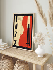 Retro Jazz art poster with large black 'JAZZ' typography, a red and beige abstract double bass, and a music quote, displayed as the same artwork in an alternate framed wall art mockup