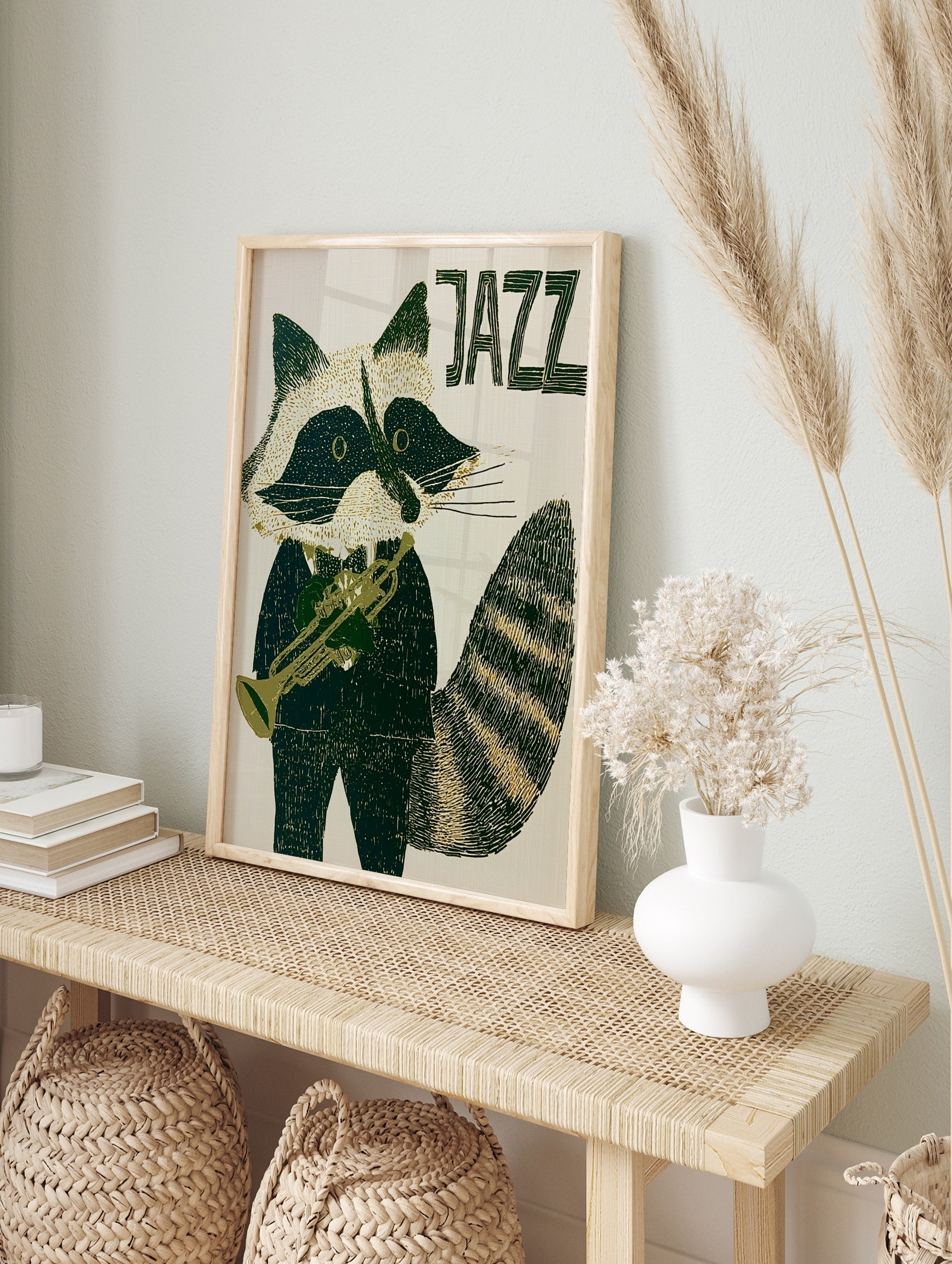 Stylised raccoon in a tuxedo playing a trumpet with JAZZ text in deep green and cream, in an alternate framed mockup