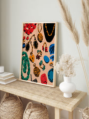 Colourful jewellery illustration print with necklaces, rings, and earrings on a peach, in an alternate framed mockup