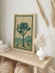 Joshua Tree poster depicting a desert landscape with mountains, two suns, and green botanical elements on brown paper. - Image 4