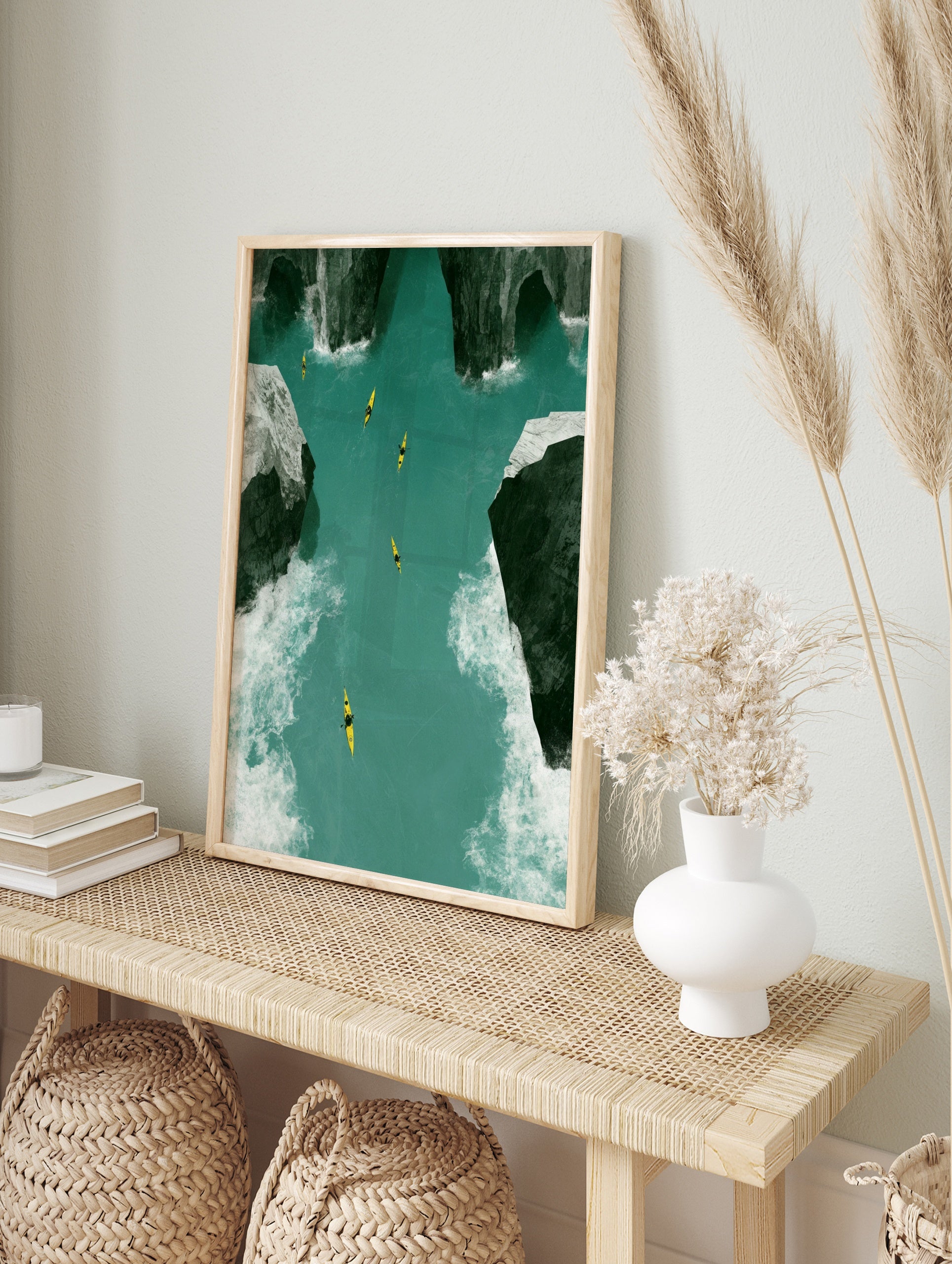 Aerial view of five yellow kayaks on a turquoise river between dark craggy rocks, nature wall, in an alternate framed mockup