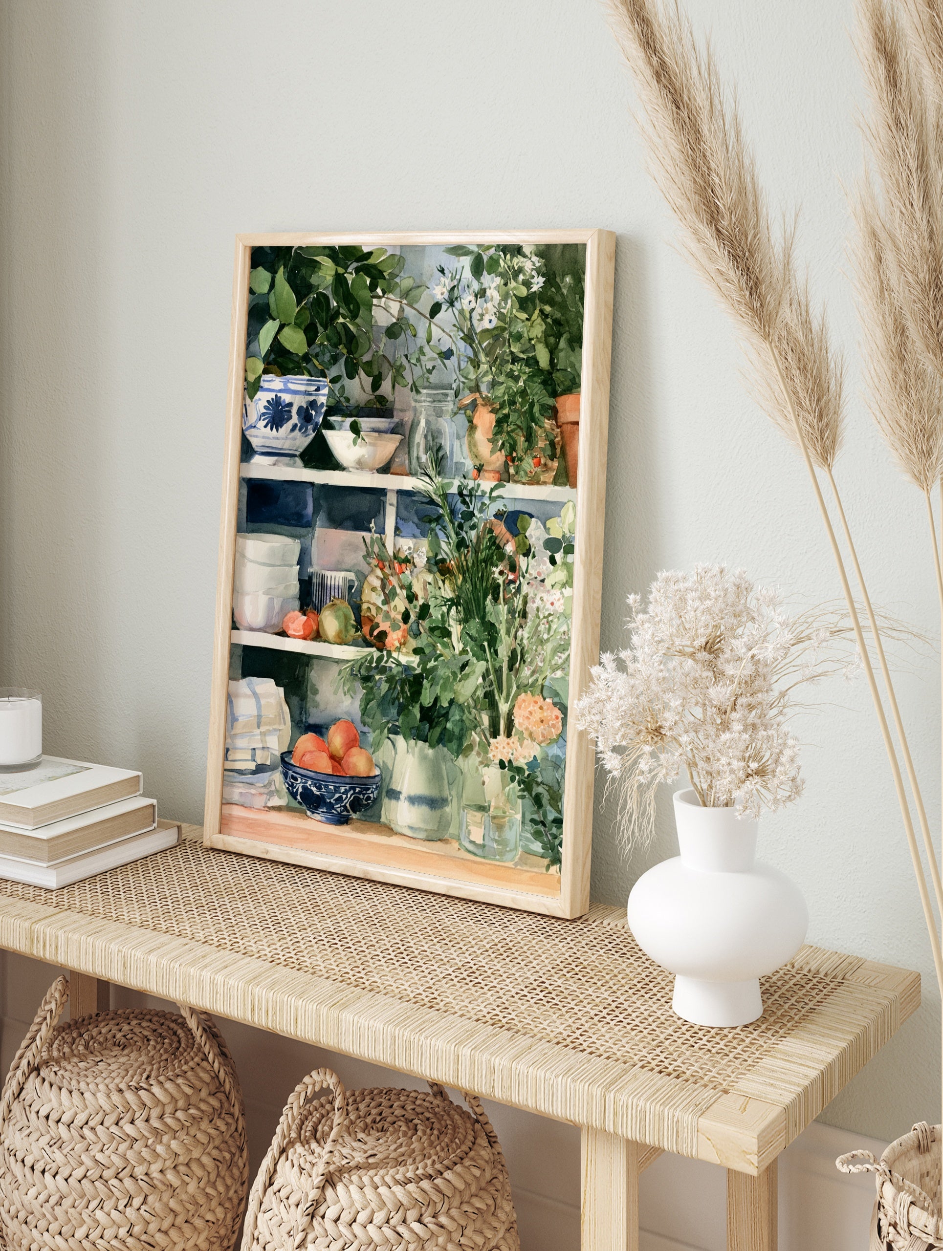 Watercolour kitchen shelf art print with blue patterned bowls, terracotta plants, and fruit, in an alternate framed mockup
