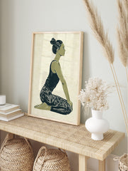 Illustrative print of a woman in a kneeling yoga pose, green and navy palette on textured, in an alternate framed mockup