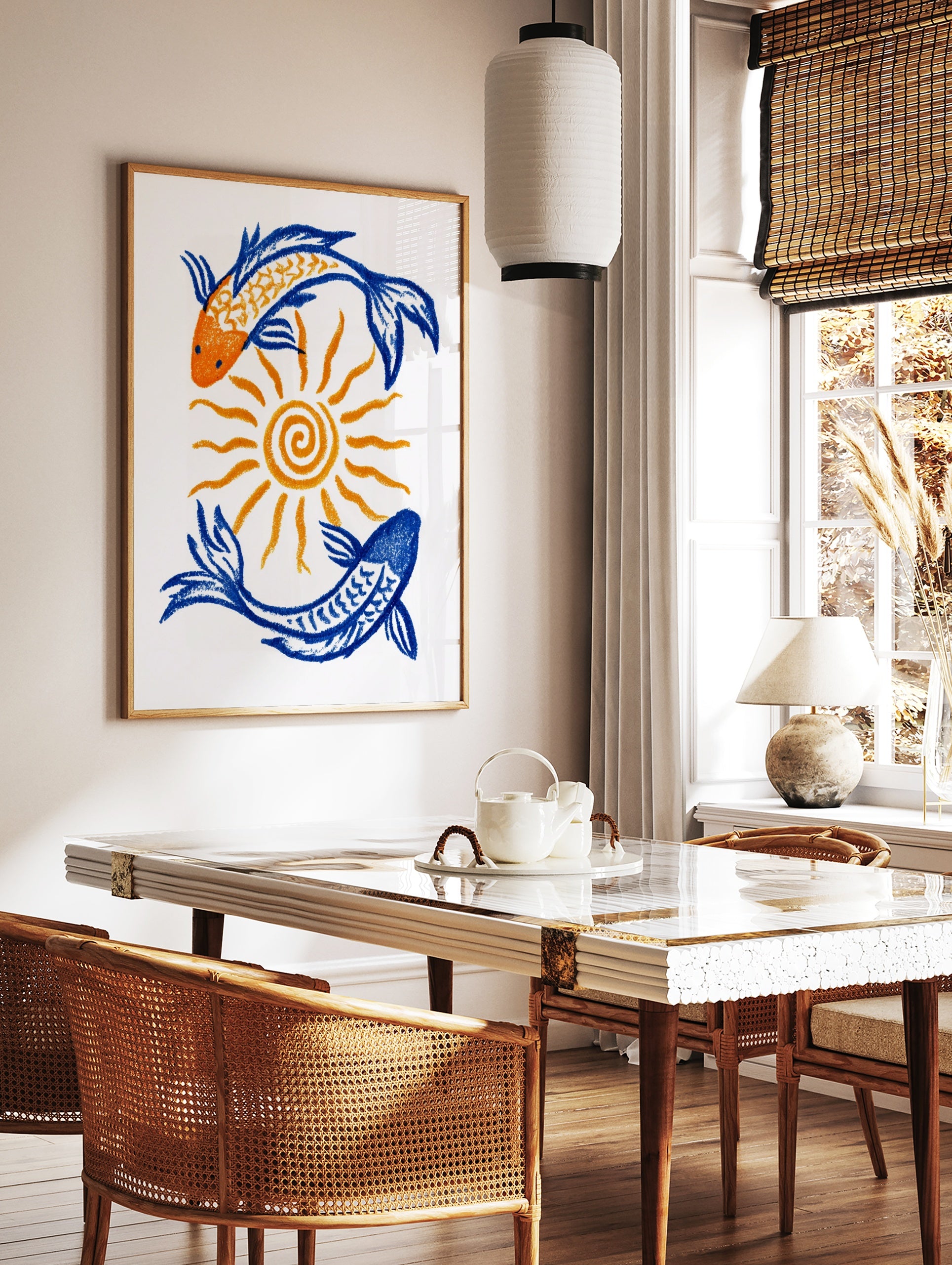 Illustrative art print featuring two koi fish in orange and blue circling a central sun on a white, in a styled room mockup