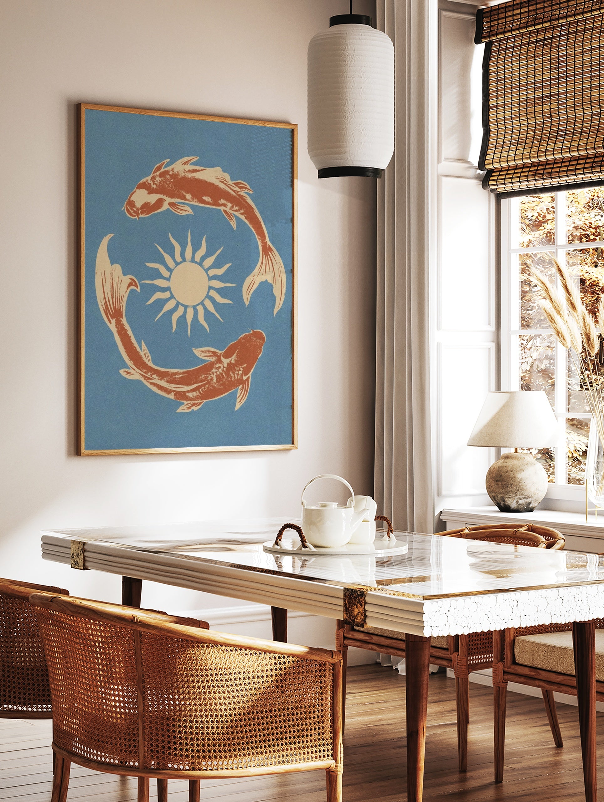 Illustrative wall art print of two koi fish swimming in a circle around a sun, terracotta orange on, in a styled room mockup