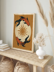 Japanese style koi fish wall art print featuring two orange fish circling a sun on a textured, in an alternate framed mockup