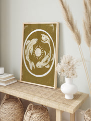 Minimalist koi fish and sun illustration art print in mustard yellow and cream on an unframed, in an alternate framed mockup