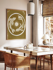 Minimalist koi fish and sun illustration art print in mustard yellow and cream on an unframed paper, in a styled room mockup