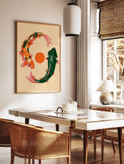 Illustrative art print of two koi fish, one orange and one green, circling an orange sun on a, in a styled room mockup