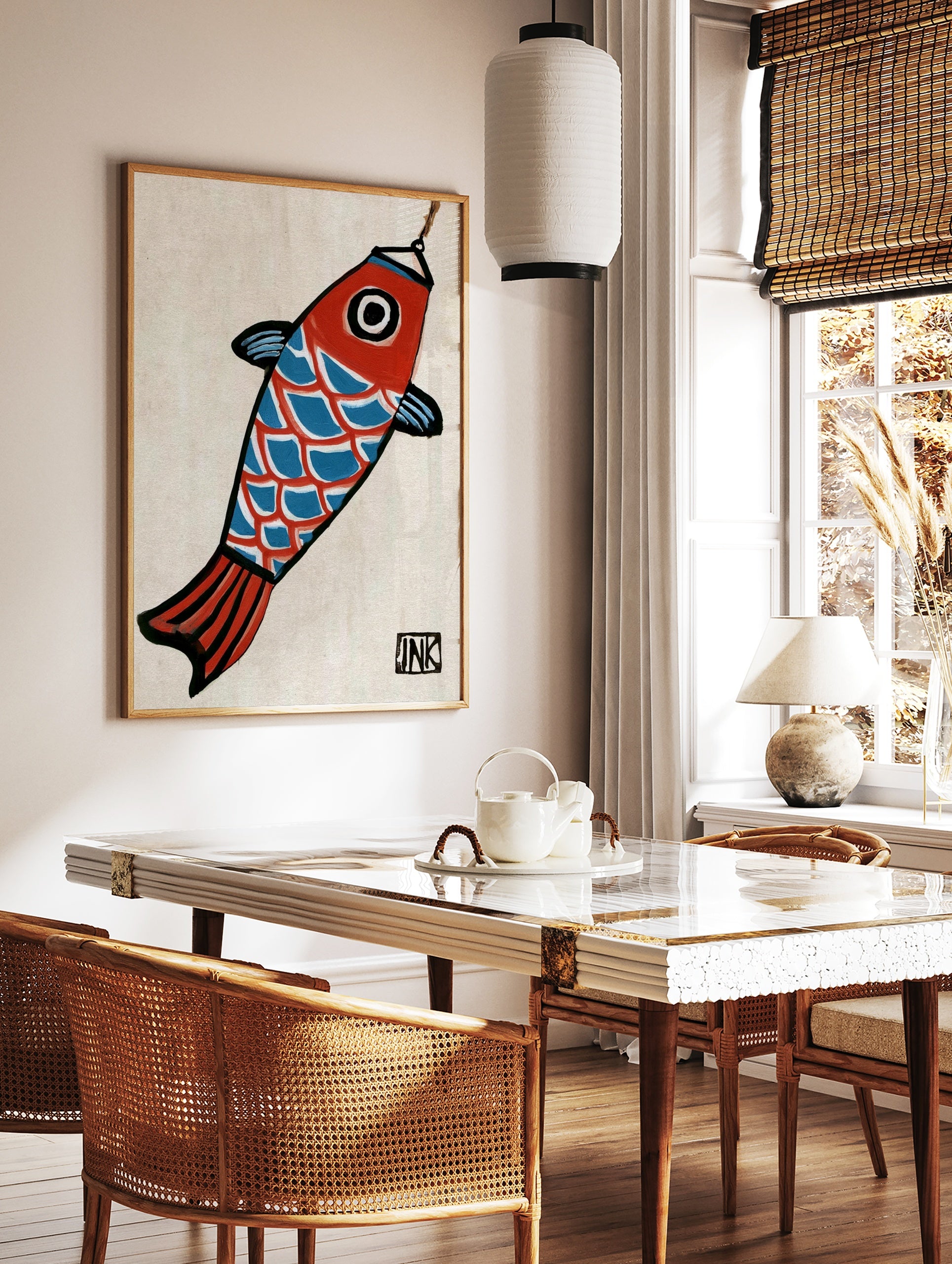 Stylized koi fish illustration with red head, blue scales, and black outlines, hanging from a hook, in a styled room mockup