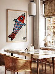 Stylized koi fish illustration with red head, blue scales, and black outlines, hanging from a hook, in a styled room mockup